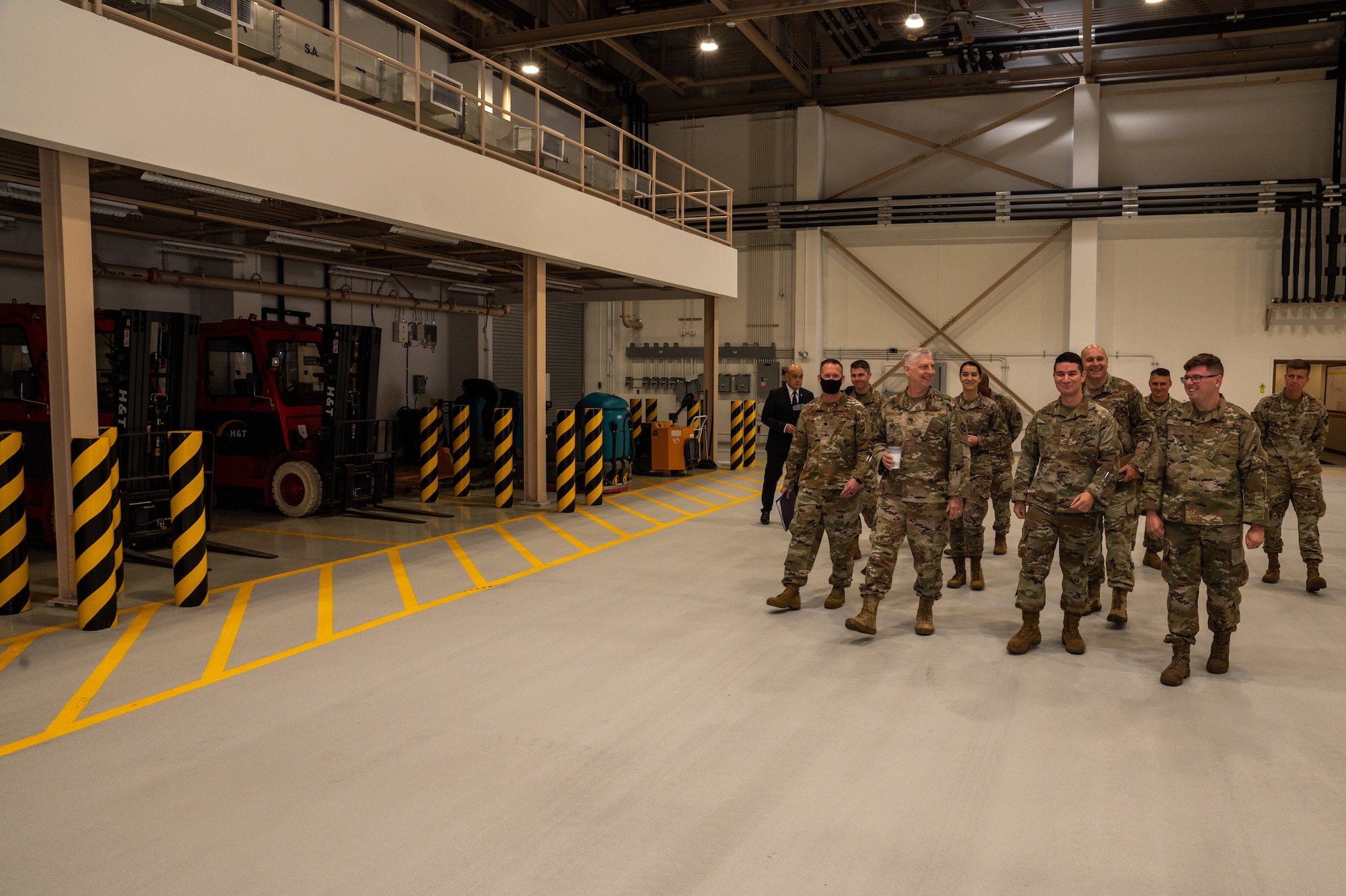 The U.S. Air Force Expeditionary Center Commander, Maj. Gen. Mark Camerer, center, receives a tour of the newly built air freight terminal warehouse at Osan Air Base, May 19, 2021. The $34 million project enhanced the squadron’s ability to support the readiness of U.S. Forces on the Korean Peninsula. (U.S. Air Force photo by Senior Airman Branden Rae)