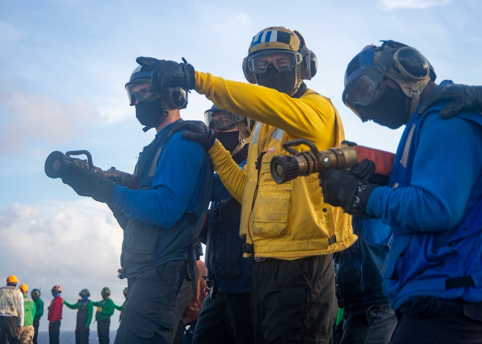 Sailors fight a simulated fire on the flight deck of the Nimitz-class aircraft carrier USS Harry S. Truman (CVN 75) during Tailored Ship's Training Availability (TSTA) and Final Evaluation Problem (FEP).