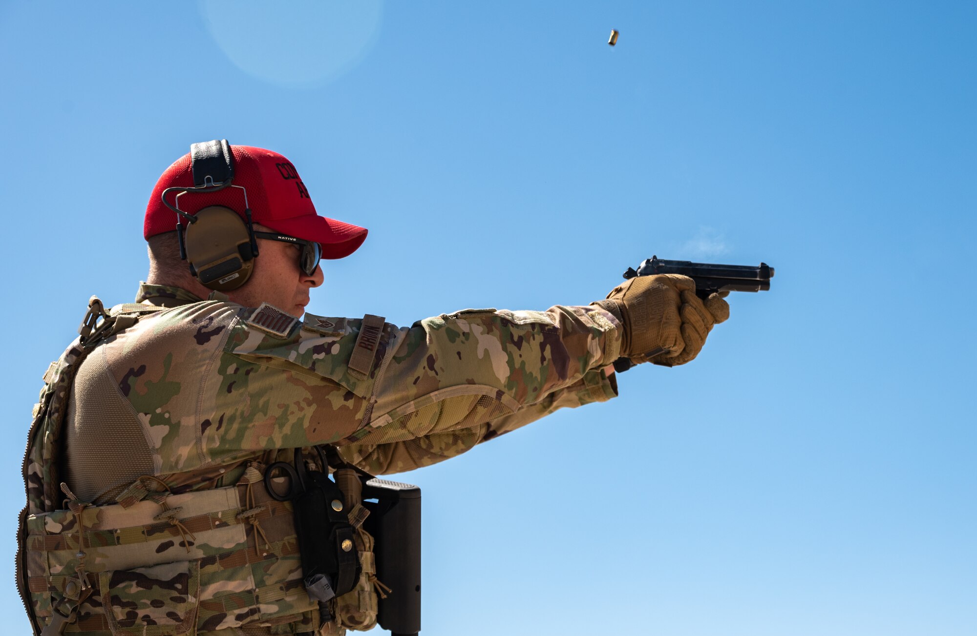 Staff Sgt. John Brown, 152nd Security Forces Squadron combat arms training and maintenance instructor, fires an M9 handgun during a live-fire training exercise at the Hawthorne Army Depot Freedom Range, Hawthorne, Nev., June 10, 2021. The instructors lead, manage, supervise and implement small arms weapons training programs.