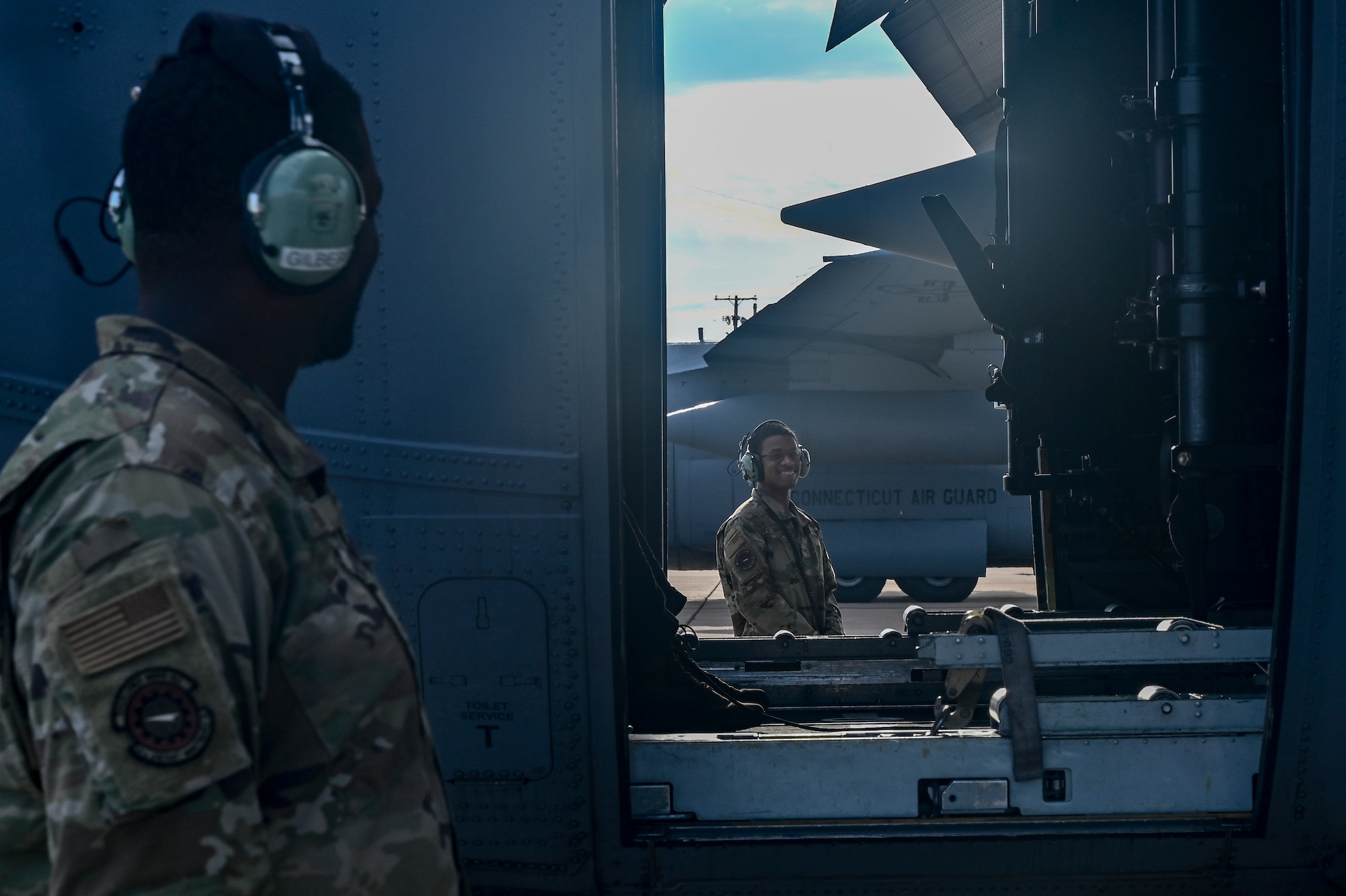 2 Airmen conduct pre-flight checks