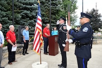 The Buffalo Grove honor guard detail, made up of police officers and fire-fighters from Buffalo Grove, render a salute during a presentation of Colors at the Village of Buffalo Grove annual Flag Day commemoration, June 14, 2021.