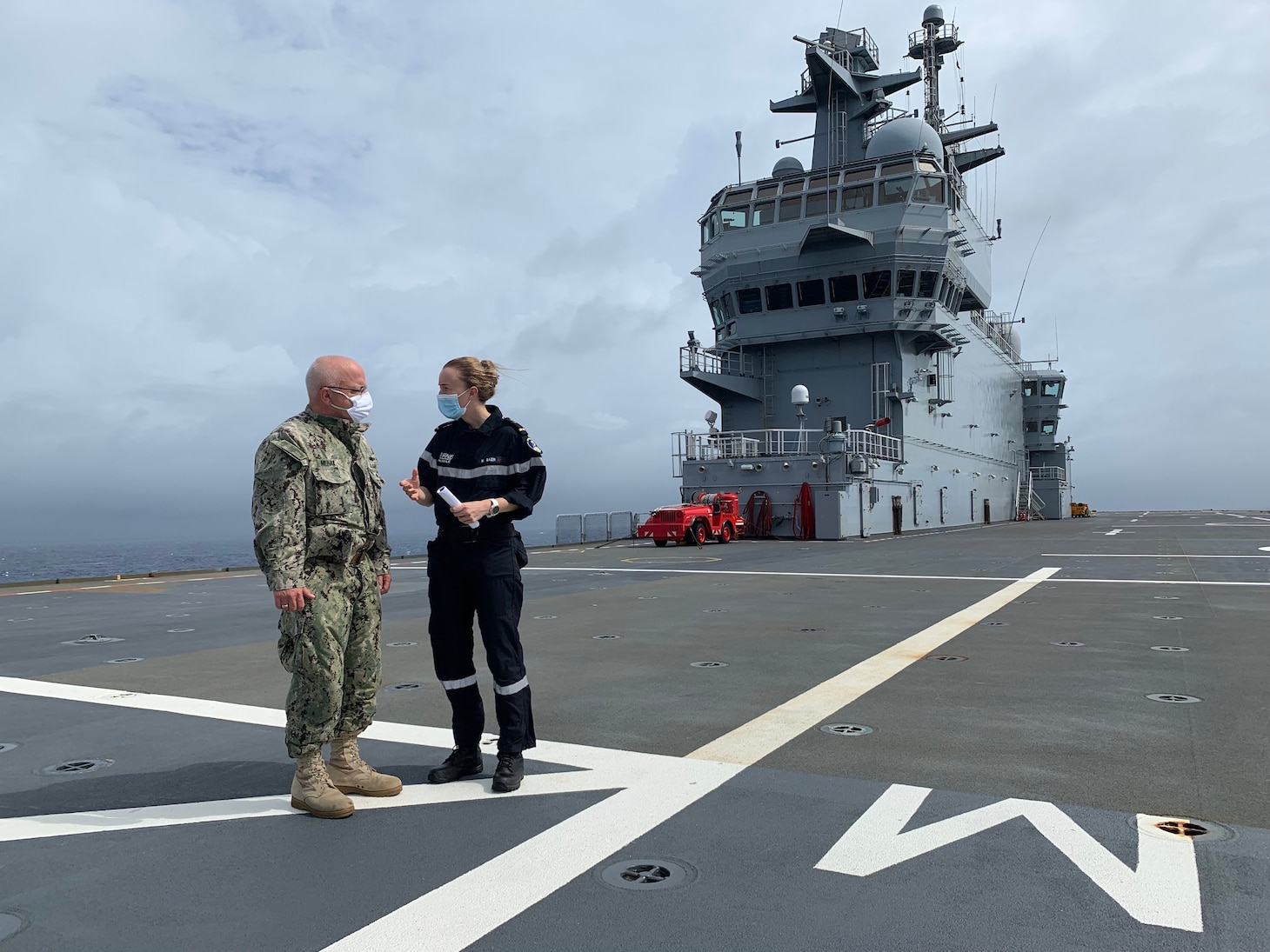 Ensign Hélène Bazin gives a tour of FS Tonnerre (L9014) to U.S. 7th Fleet's Enforcement Coordination Cell (ECC) director, Capt. James J. Mehail. “It was a great opportunity to meet the ECC Director, and give a face to this multinational operation we are participating in," said Bazin. "Moreover, it has a huge benefit for all our midships to plunge into the reality of maritime operations." As the U.S. Navy's largest forward-deployed fleet, 7th Fleet employs 50-70 ships and submarines across the Western Pacific and Indian oceans. U.S. 7th Fleet routinely operates and interacts with 35 maritime nations while conducting missions to preserve and protect a free and open Indo-Pacific Region.