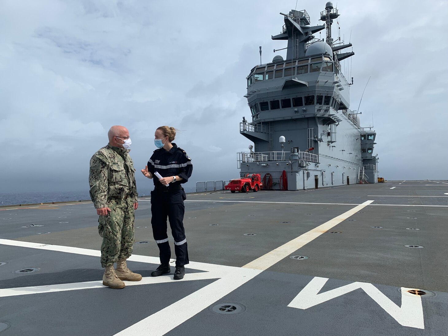 Ensign Hélène Bazin gives a tour of FS Tonnerre (L9014) to U.S. 7th Fleet's Enforcement Coordination Cell (ECC) director, Capt. James J. Mehail. “It was a great opportunity to meet the ECC Director, and give a face to this multinational operation we are participating in," said Bazin. "Moreover, it has a huge benefit for all our midships to plunge into the reality of maritime operations." As the U.S. Navy's largest forward-deployed fleet, 7th Fleet employs 50-70 ships and submarines across the Western Pacific and Indian oceans. U.S. 7th Fleet routinely operates and interacts with 35 maritime nations while conducting missions to preserve and protect a free and open Indo-Pacific Region.