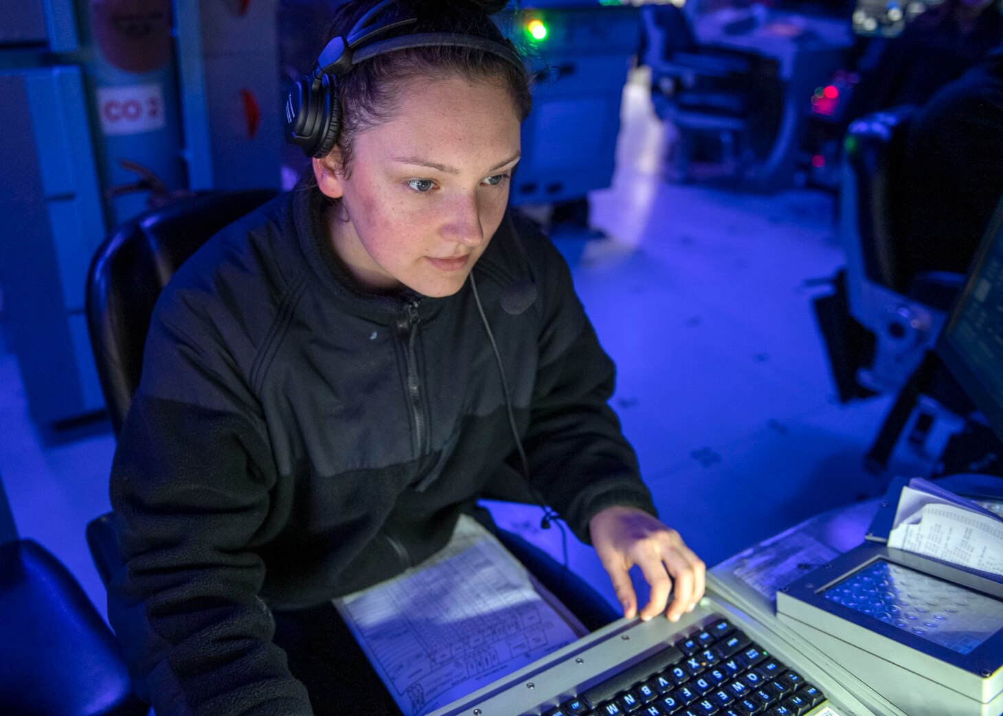 Operations Specialist Seaman Apprentice Abigail Talton, from Dayton, Ohio, tracks surface contacts during routine underway operations aboard Arleigh Burke-class guided-missile destroyer USS Rafael Peralta (DDG 115). Rafael Peralta is assigned to Commander, Task Force 71/Destroyer Squadron (DESRON) 15, the Navy's largest forward-deployed DESRON and U.S. 7th Fleet's principal surface force.