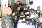 Virginia Defense Force personnel assigned to the Communication Battalion, Support Operations Group relay message traffic in a Mobile Communication Platform June 5, 2021, in Lynchburg, Virginia.