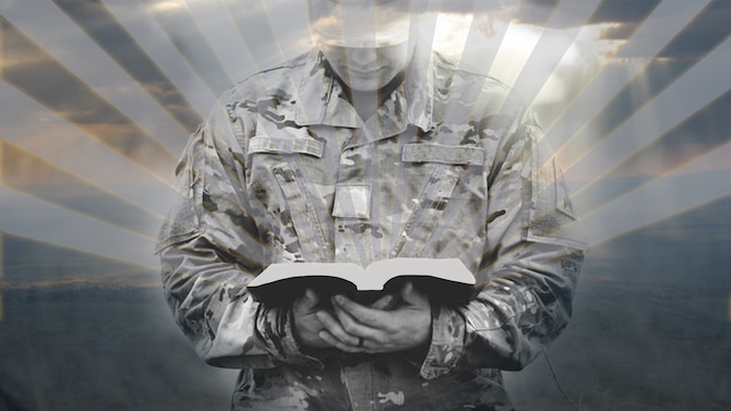 Picture of servicemember holding a book that has rays of sunshine extending out from it.