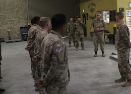 Commanding General of 1st Theater Sustainment Command, Maj. Gen. John P. Sullivan, speaks to riggers of the Fort Bragg, N.C., based 151st Quartermaster Detachment, during his June 10, 2021 visit to the Eric T. Burri U.S. Army Rigging Facility at Al Udeid Air Base, Qatar. The general told the riggers that their contributions to sustainment operations in the field were relied on and appreciated.