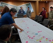Officials from Joint Base Langley-Eustis review the area development plan during the 43rd Formal Training Unit Bed down charrette in 2019. Planning and Programming Support Branch received national award their plan during the American Planning Associations 2021 National Federal Planning Division Conference.