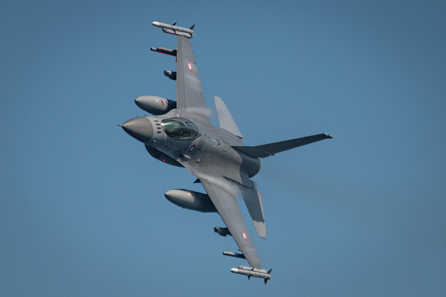 Danish F-16 Fighters participate in an Air-Defence Exercise (ADEX) with the Standing NATO Maritime Group One (SNMG1) Task Group and its consorts off the coast of Denmark on June 9th, 2021 during Exercise BALTOPS 50. BALTOPS is an annual joint, multinational maritime-focused defence exercise designed to enhance interoperability, flexibility, and demonstrate resolve among Allied and partner forces to defend the Baltic Sea Region. It involves maritime and air forces, strengthening combined response capabilities necessary to ensure regional security and stability.