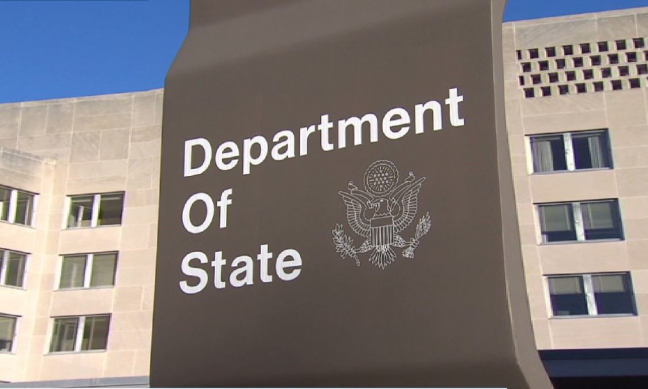A sign outside a building reads "Department of State."