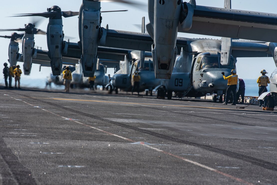 Sailors assigned to the amphibious assault ship USS Makin Island (LHD 8) prepare MV-22 Ospreys assigned to Marine Medium Tiltrotor Squadron 164 (Reinforced), 15th Marine Expeditionary Unit for takeoff during a long-range raid training event.