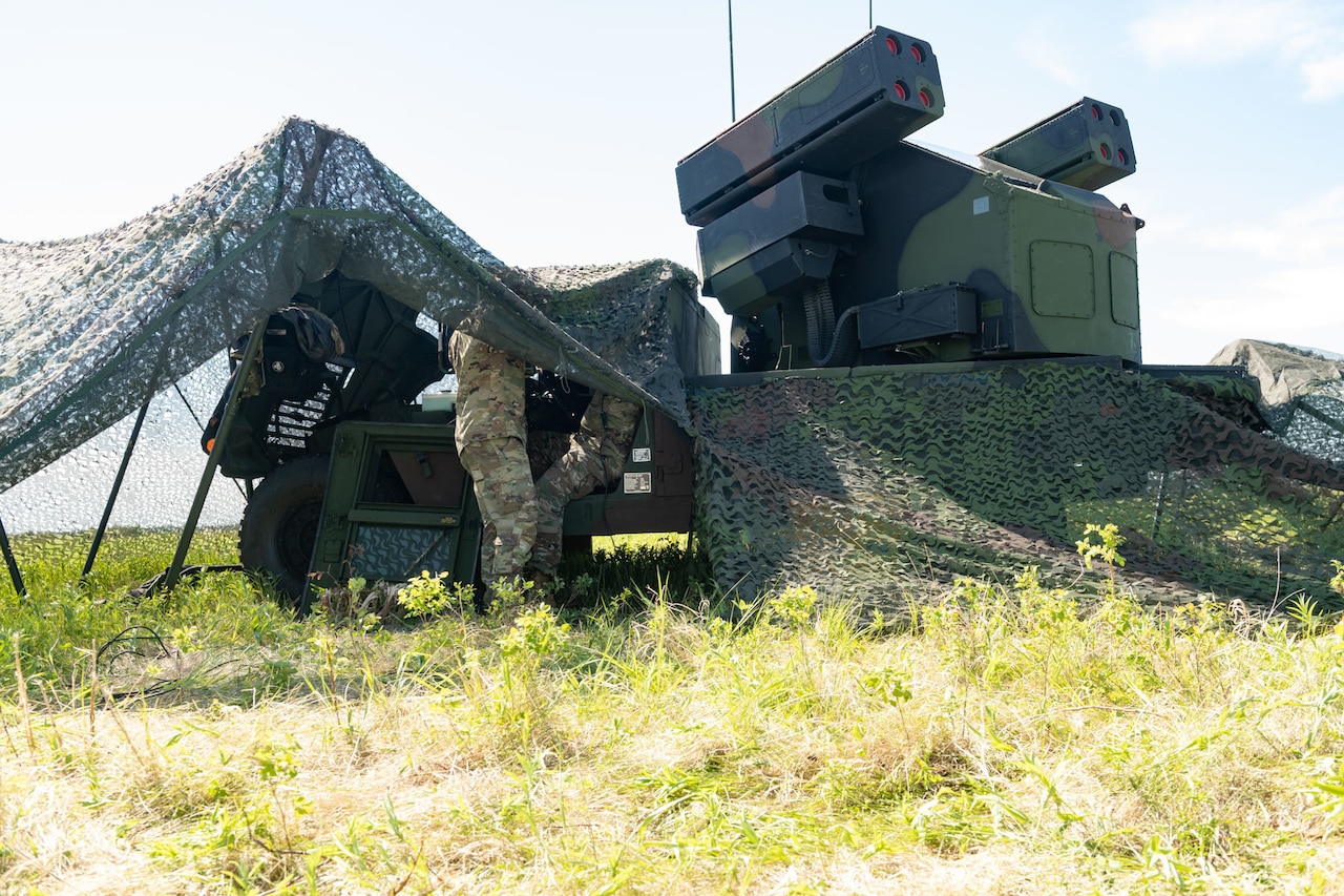 Troops set up a missile launcher.