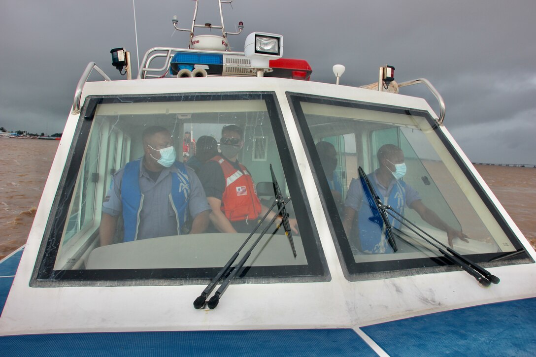 The Guyana Coast Guard, practices drills aboard a small boat with members of the U.S. and Guyana Coast Guard.