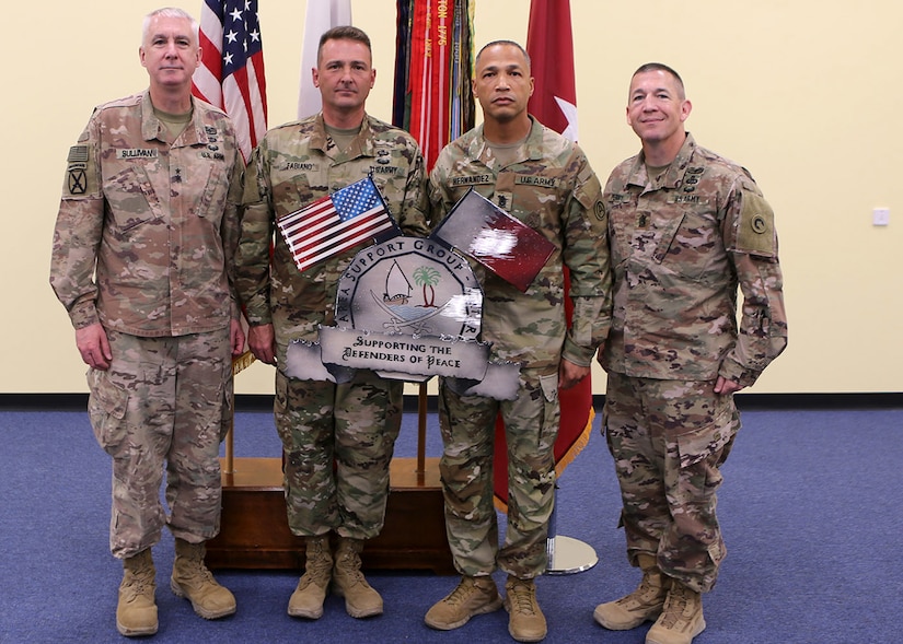 The last command team of Area Support Group-Qatar, Col. Stephen Fabriano (second from the left) and Command Sgt. Maj. Jose Hernandez (third from left), stand with Maj. Gen. John P. Sullivan, the commanding general of the 1st Theater Sustainment Command (far left) and 1st TSC Command Sgt. Maj. Michael J. Perry (far right) at the June 10, 2021 Camp As Sayliyah end of mission ceremony, where ASG-Qatar's colors were cased. The Army established ASG-Qatar in 1992, and for the last three decades, the military and civilian personnel deployed there have supported military and humanitarian operations in the region. The ASG-Qatar was merged with ASG-Jordan as part of the Army's ongoing realignment of assets and personnel. (U.S. Army photo by David Gomes)