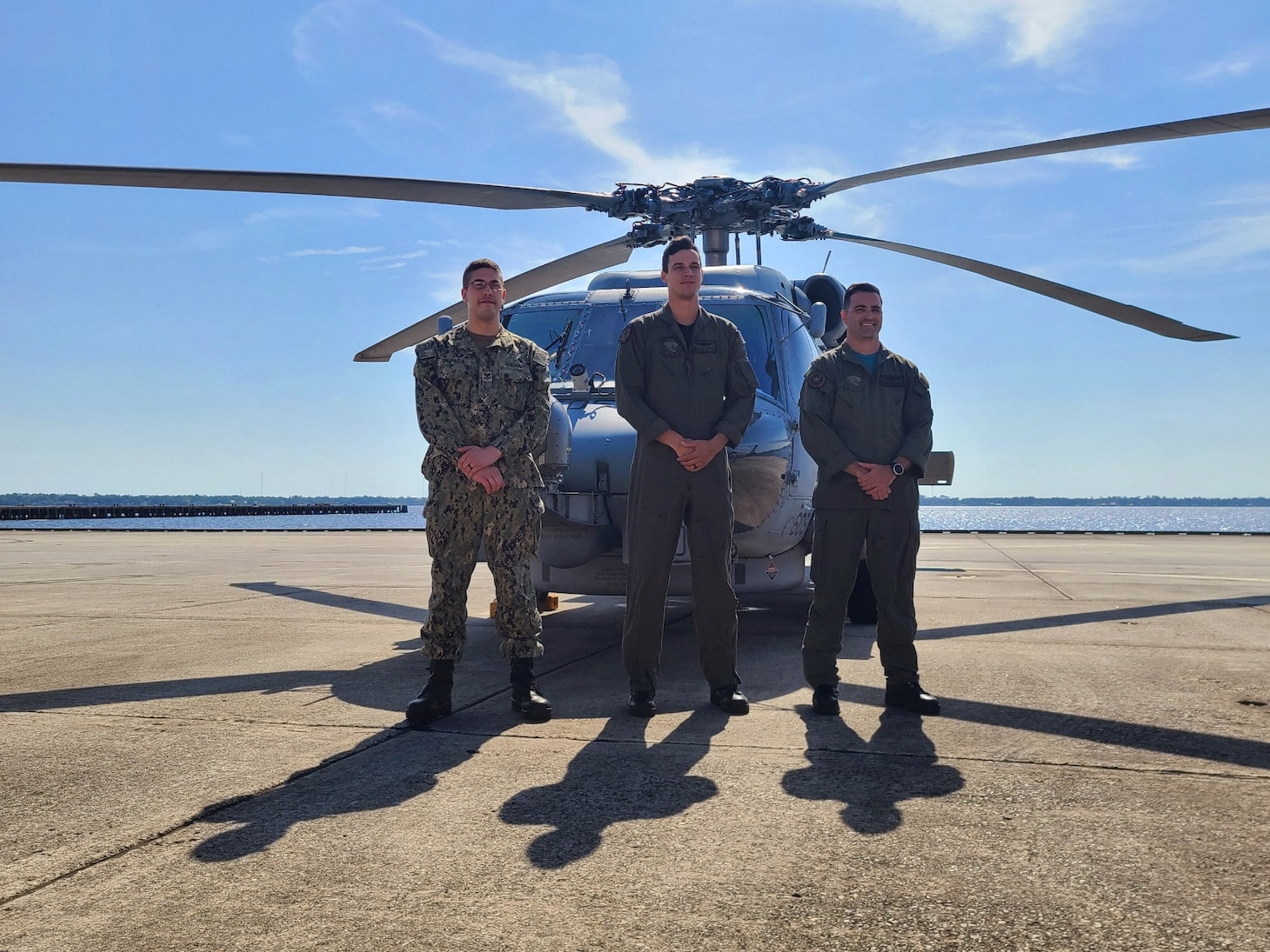 Pictured from left to right: HM1 Aaron Pruneda, AWR2(NAC/AW/SW) Jacob Dawson, and AWR2(NAC/AW/SW/SS/DV) Steven Heyliger, (not pictured AWR2 Richard Maier) pose for a photograph.