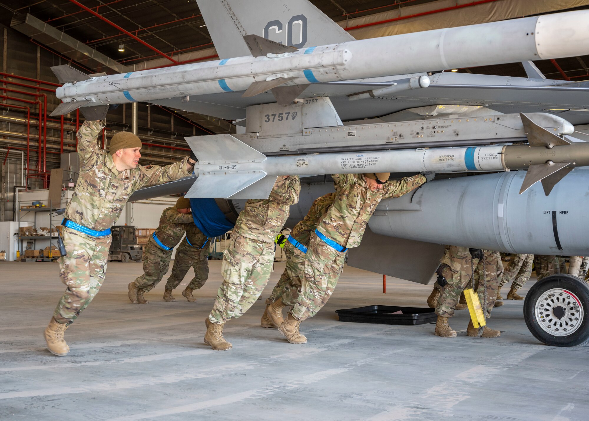U.S. Air Force Airmen assigned to the 140th Wing, Buckley Space Force Base, Colorado, push a F-16 Fighting Falcon out from a hangar June 15, 2021