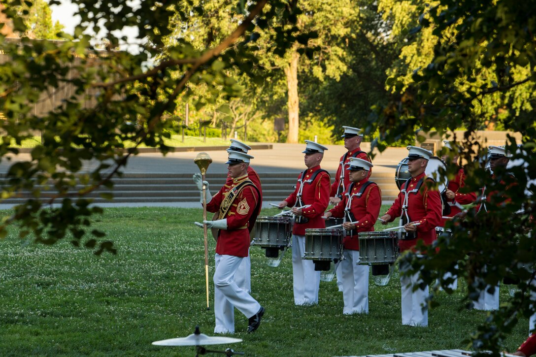 Master GySgt. Keith Martinez, drum major, “The Commandant’s Own,” U.S. Marine Drum and Bugle Corps, leads the Marines across the parade deck during a Tuesday Sunset Parade at the Marine Corps War Memorial, Arlington, VA, June 15, 2021. The hosting official for the evening was Brig. Gen. Lorna Mahlock, Director, Information, Command, Control, Communications and Computers, and Ms. Gwynne Shotwell, President and Chief Operations Officer of SpaceX, was the guest of honor. (U.S. Marine Corps photo by Lance Cpl. Allen Sanders)