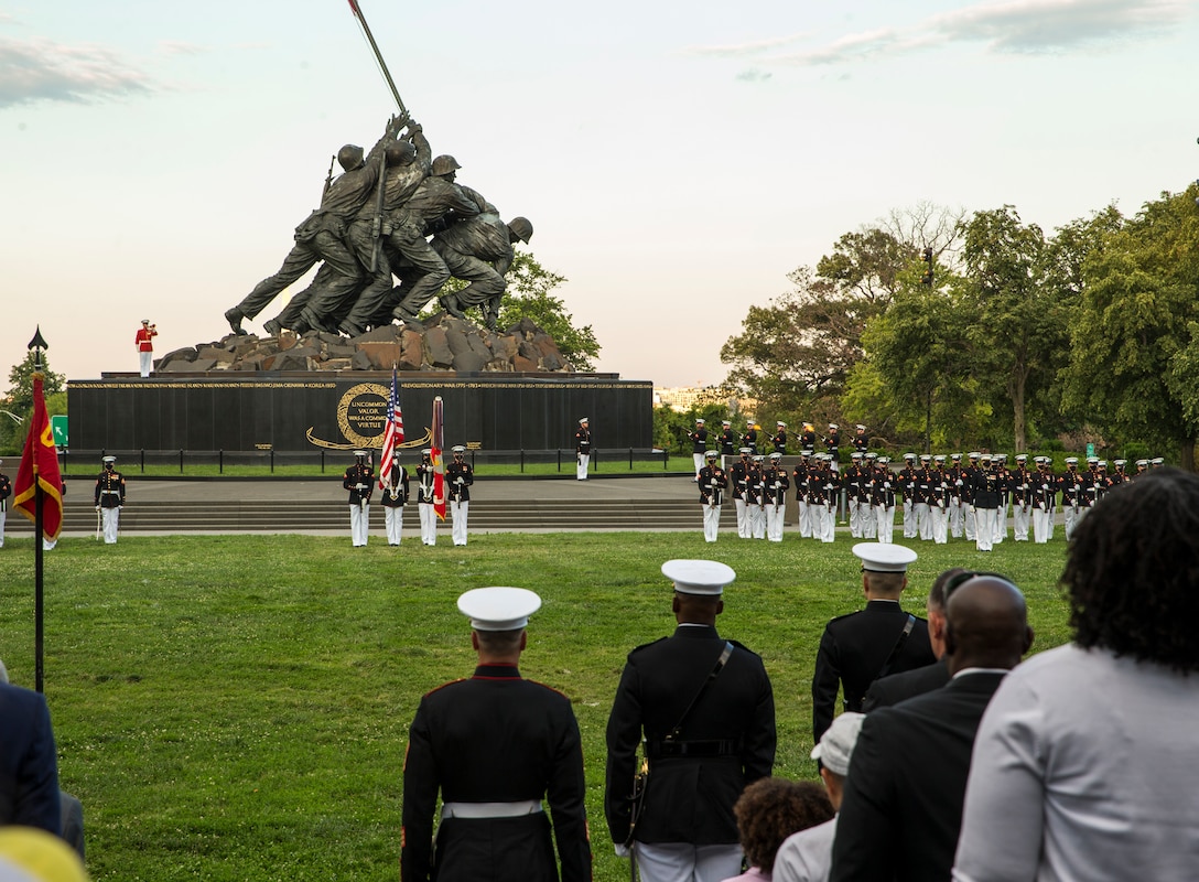 Marines with Marine Barracks Washington execute “present arms” for the three-round volley during a Tuesday Sunset Parade at the Marine Corps War Memorial, Arlington, VA, June 15, 2021. The hosting official for the evening was Brig. Gen. Lorna Mahlock, Director, Information, Command, Control, Communications and Computers, and Ms. Gwynne Shotwell, President and Chief Operations Officer of SpaceX, was the guest of honor. (U.S. Marine Corps photo by Lance Cpl. Allen Sanders)