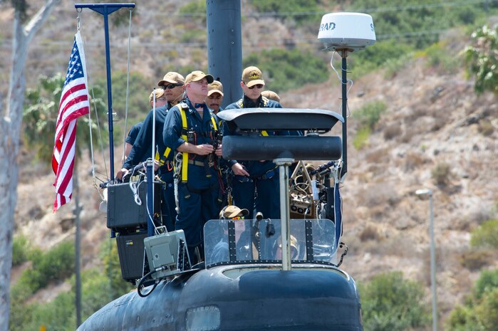 Sailors assigned to the Los Angeles-class fast-attack submarine USS Hampton (SSN 767) depart Naval Base Point Loma for a western Pacific deployment.