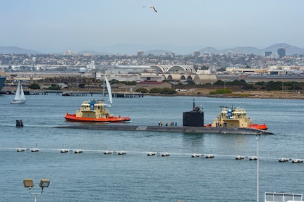 Sailors assigned to the Los Angeles-class fast-attack submarine USS Hampton (SSN 767) depart Naval Base Point Loma for a western Pacific deployment.