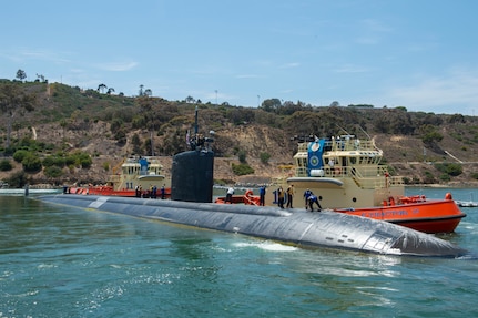 Sailors assigned to the Los Angeles-class fast-attack submarine USS Hampton (SSN 767) depart Naval Base Point Loma for a western Pacific deployment.