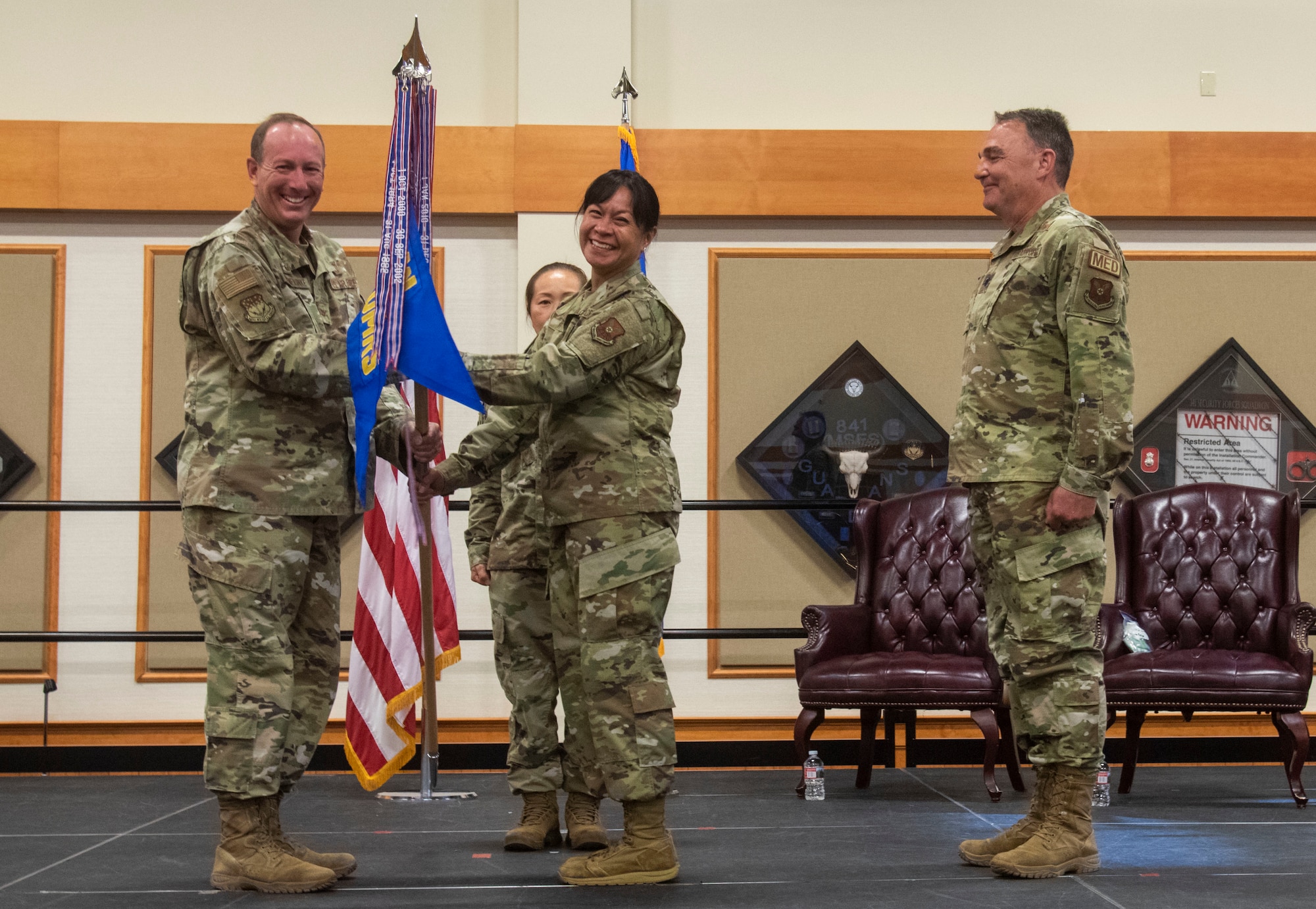 Lt. Col. Michelle Dimoff, 341st Operational Medical Readiness Squadron outgoing commander, right, relinquishes command to Col. Mark Pomerinke, 341st Medical Group commander, during a change of command ceremony, June 16, 2021 at Malmstrom Air Force Base, Mont.