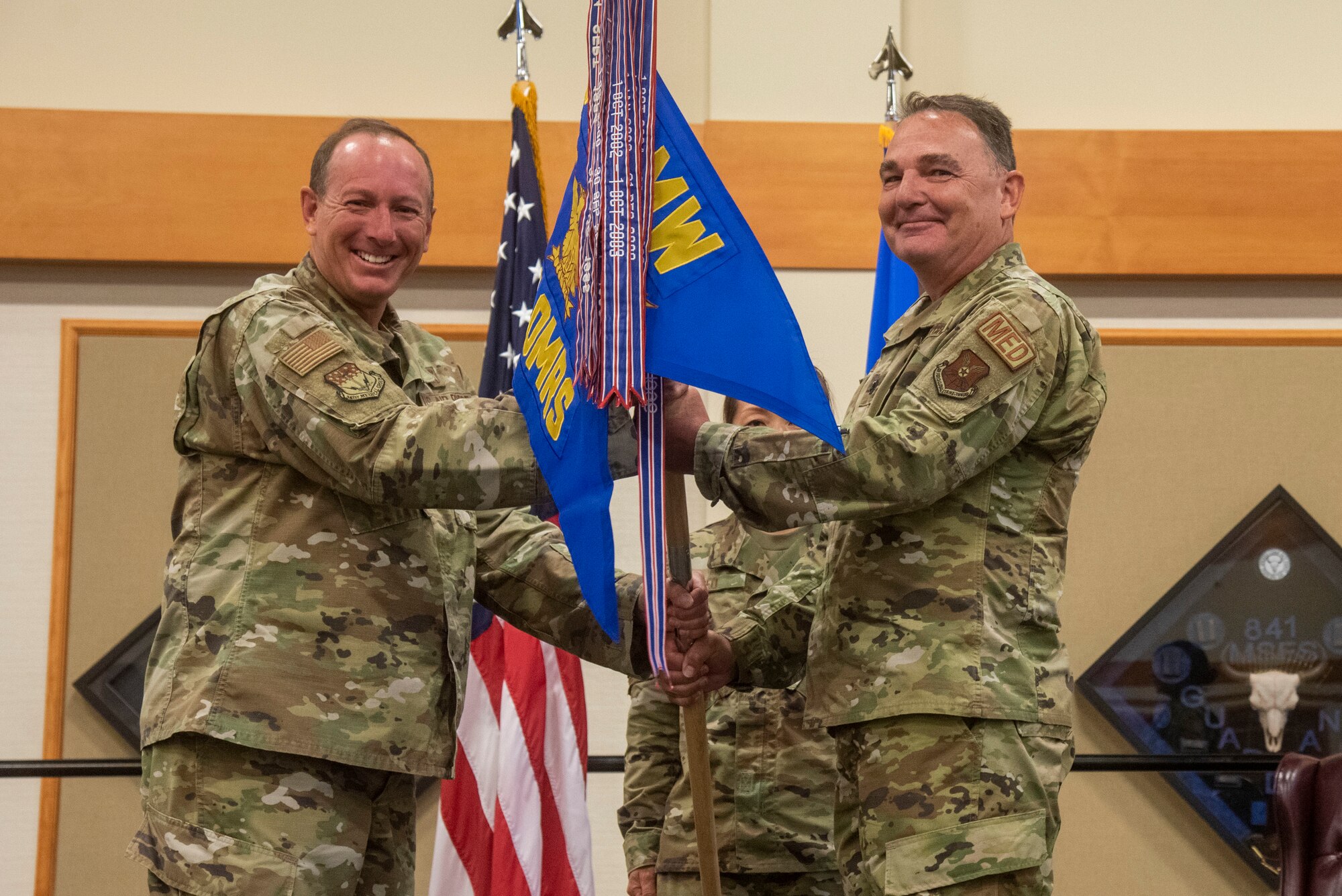Lt. Col. Darren Damiani, 341st OMRS incoming commander, right, assumes command from Col. Mark Pomerinke, 341st Medical Group commander, during a change of command ceremony, June 16, 2021 at Malmstrom Air Force Base, Mont.