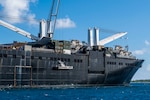 DIEGO GARCIA, British Indian Ocean Territory (November 11, 2019) Sailors lower a maritime prepositioning force utility boat from Military Sealift Command Bob Hope-class roll-on roll-off vehicle cargo ship USNS Seay (T-AKR 302) using a crane during an Improved Navy Lighterage System (INLS) training mission. Navy Cargo Handling Battalion (NCHB) 1, NCHB 8, NCHB 11, NCHB 13, Assault Craft Unit (ACU) 1 and Amphibious Construction Battalion (ACB) 1 are participating in the INLS training mission under the direction of Commander, Task Force (CTF) 75 in preparation for upcoming joint cargo handling exercise Native Fury 2020. (U.S. Navy photo by Mass Communication Specialist 1st Class Nathan Carpenter)