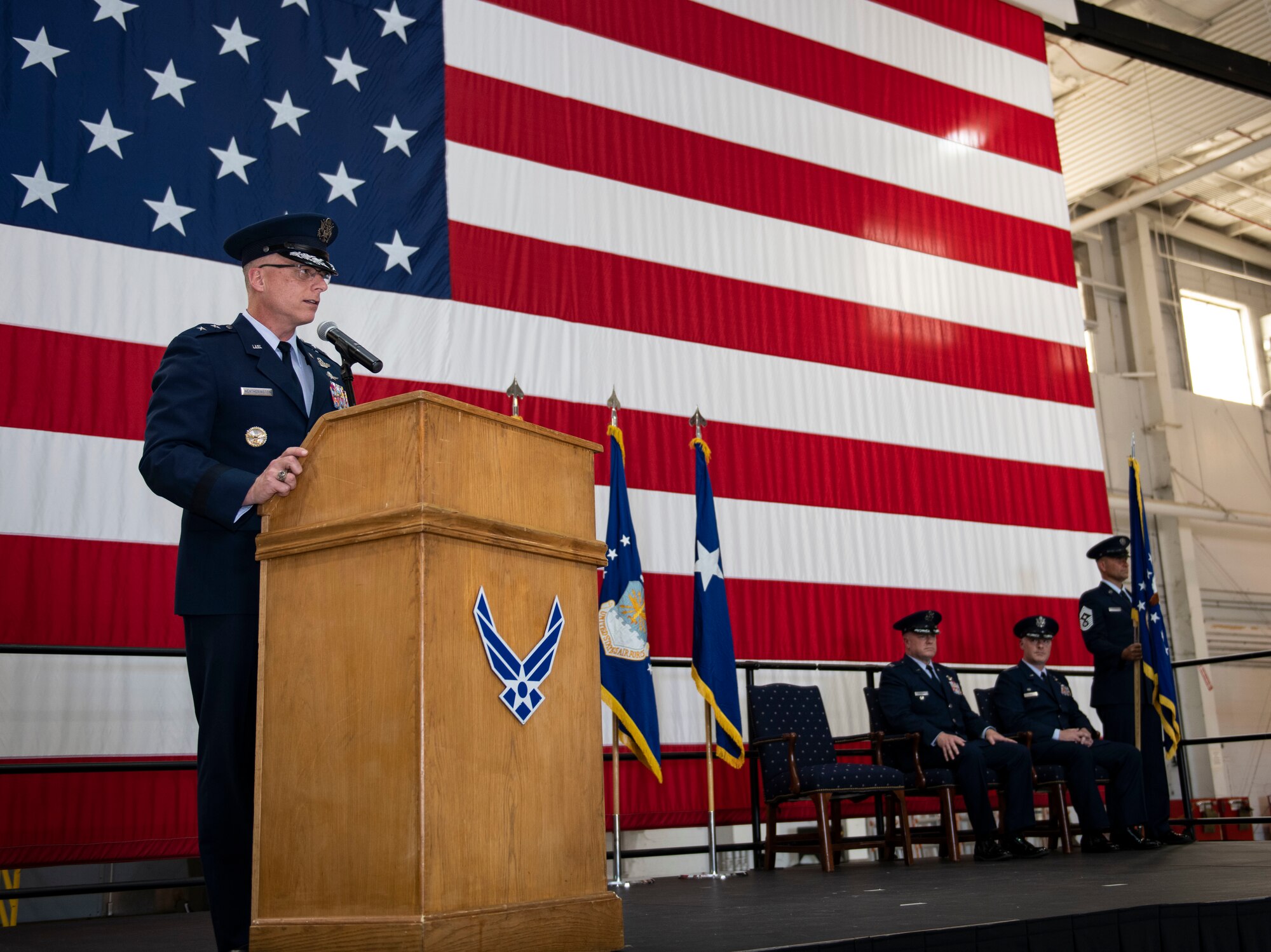 U.S. Air Force Maj. Gen. Mark Weatherington, Eighth Air Force and Commander Joint-Global Strike Operations Center, thanks Col. Jeffrey Schreiner, former 509th Bomb Wing commander, for his service and welcomes Col. Daniel Diehl, in-coming 509th BW commander, during the 509th BW change of command ceremony, Whiteman Air Force Base, Missouri, June 16, 2021. Military change-of-commands are a time-honored tradition that formally symbolizes the continuity of authority as the command passes from one individual to another. The transfer of command is physically represented by handing the command flag, the tangible symbol of the unit, from the outgoing commander to the new. (U.S. Air Force photo by Airman First Class Victoria Hommel)