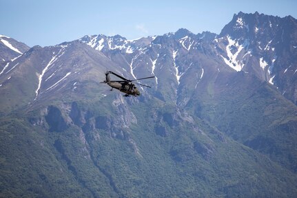 Pilots and crew members of the Alaska Army National Guard's 1st Battalion, 207th Aviation Regiment fly ground search and rescue teams with Alaska Mountain Rescue Group and MAT+SAR Search & Rescue to various locations on Pioneer Peak near Palmer, AK, to search for a missing hiker, June 15, 2021. (U.S. Army National Guard photo by Spc. Grace Nechanicky)