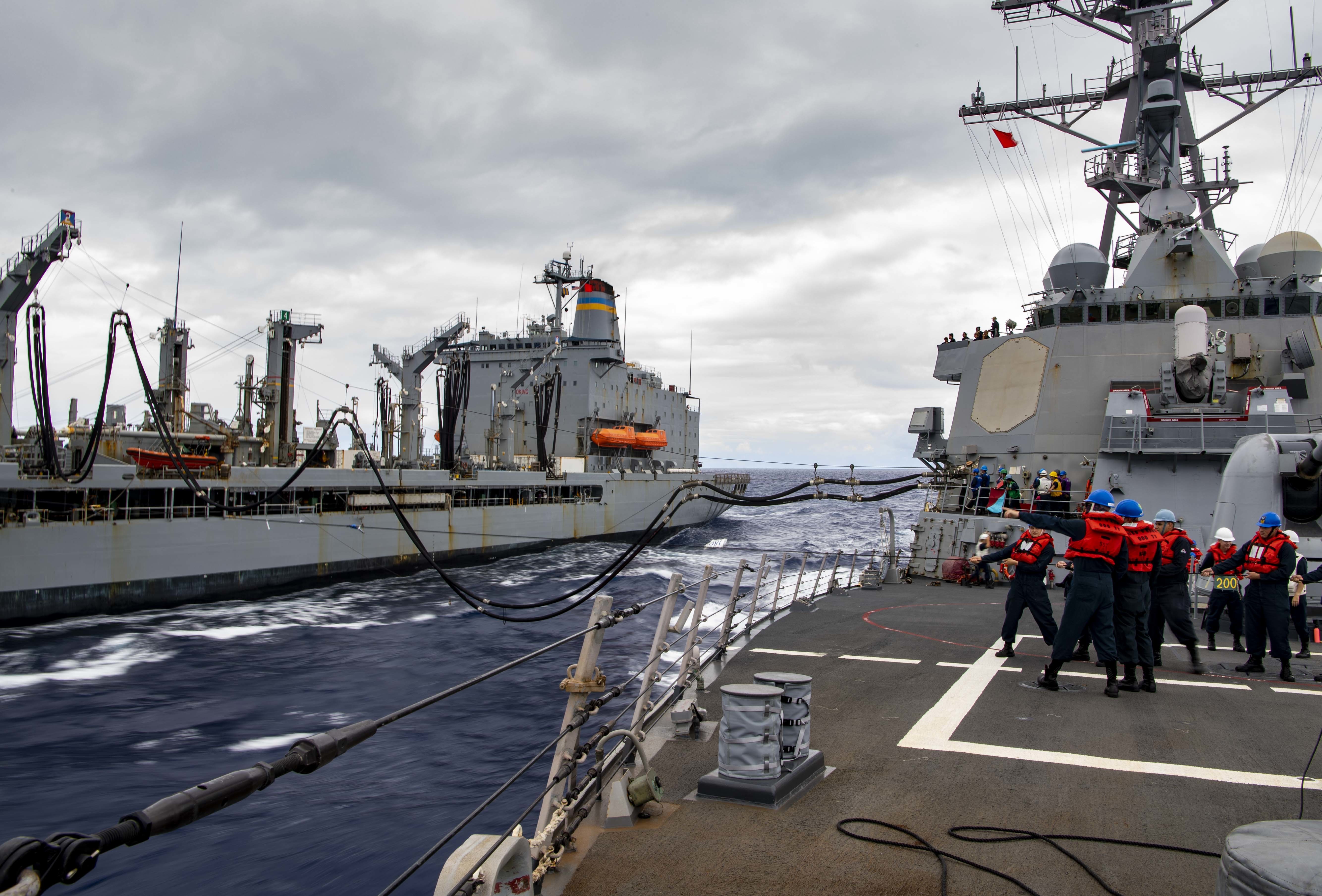 Sailors aboard the Arleigh Burke-class guided-missile destroyer USS O’Kane (DDG 77) conduct a replenishment-at-sea with the fleet replenishment oiler USNS Guadalupe (T-AO 200).