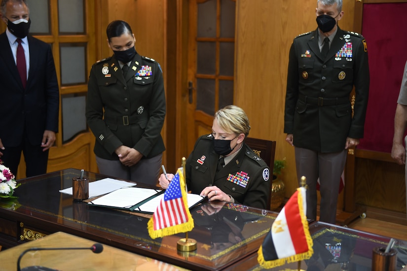 Army Maj. Gen. Tracy Norris, adjutant general, Texas National Guard, signs a document formalizing the pairing of Egypt and the Texas National Guard in the Department of Defense National Guard State Partnership Program, Cairo, Egypt, June 14, 2021. (U.S. Army National Guard photo by Master Sgt. Jim Greenhill)