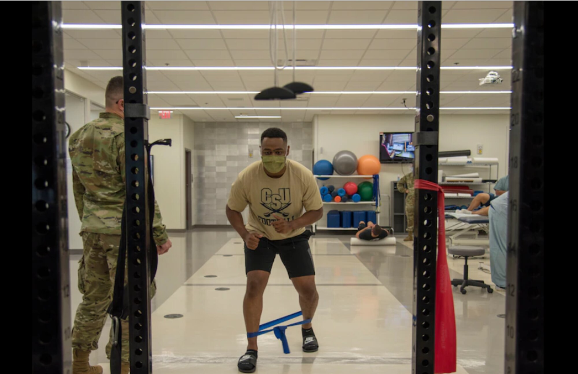 Airman 1st Class Kameron Burton-Reeder, 502nd Comptroller Squadron budgeting and accounting technician, does monster walks in the Physical Therapy Clinic at Wilford Hall Ambulatory Surgical Center, Joint Base San Antonio-Lackland, Texas, June 8, 2021. June is National Men’s Health month to heighten awareness of preventable health problems and encourage early detection and treatment of disease. (U.S. Air Force photo by Airman 1st Class Melody Bordeaux)