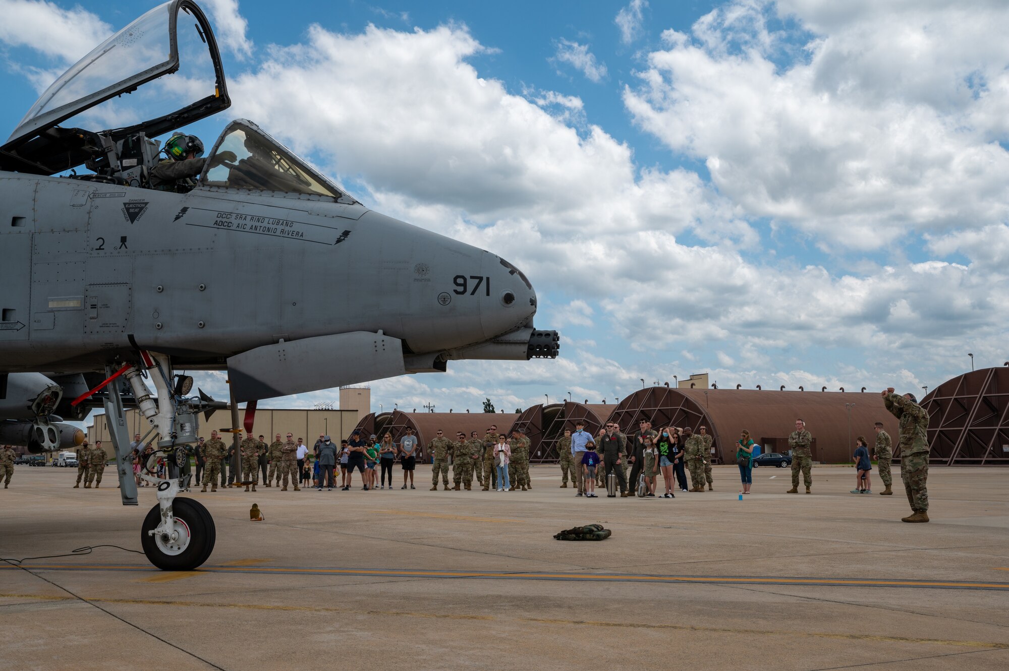 U.S. Air Force Chief Master Sgt. Justin Apticar, 51st Fighter Wing command chief, marshalled Col. John Gonzales, 51st Fighter Wing commander, piloting an A-10 Thunderbolt II after his final flight at Osan Air Base, Republic of Korea, June 16, 2021. Family, friends, and co-workers gathered on the flightline to congratulate Gonzales and wish him well as he moves on to his next base. (U.S. Air Force photo by Senior Airman Branden Rae)