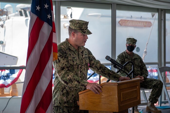 210615-N-KZ419-1240 NAVAL SUPPORT ACTIVITY BAHRAIN (June 15, 2021) Lt. Nathan Zinn, commanding officer of USCGC Aquidneck (WPB 1309), delivers remarks during the decommissioning ceremony for Aquidneck and USCGC Adak (WPB 1333) onboard Naval Support Activity Bahrain, June 15. Adak and Aquidneck operated in the U.S. 5th Fleet area of operations since 2003 in support of Operation Iraqi Freedom, Enduring Freedom, Inherent Resolve and Spartan Shield. (U.S. Navy photo by Mass Communication Specialist 3rd Class Dawson Roth)