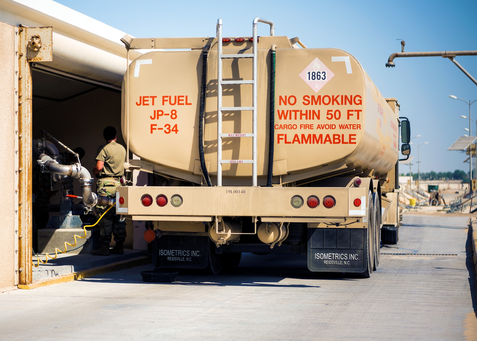 U.S. Air Force Airmen from the 380th Expeditionary Civil Engineer Squadron water & fuel systems maintenance and the 380th Expeditionary Logistic Readiness Squadron fuels flight perform maintenance on a fuels system at Al Dhafra Air Base, United Arab Emirates, June 14, 2021.