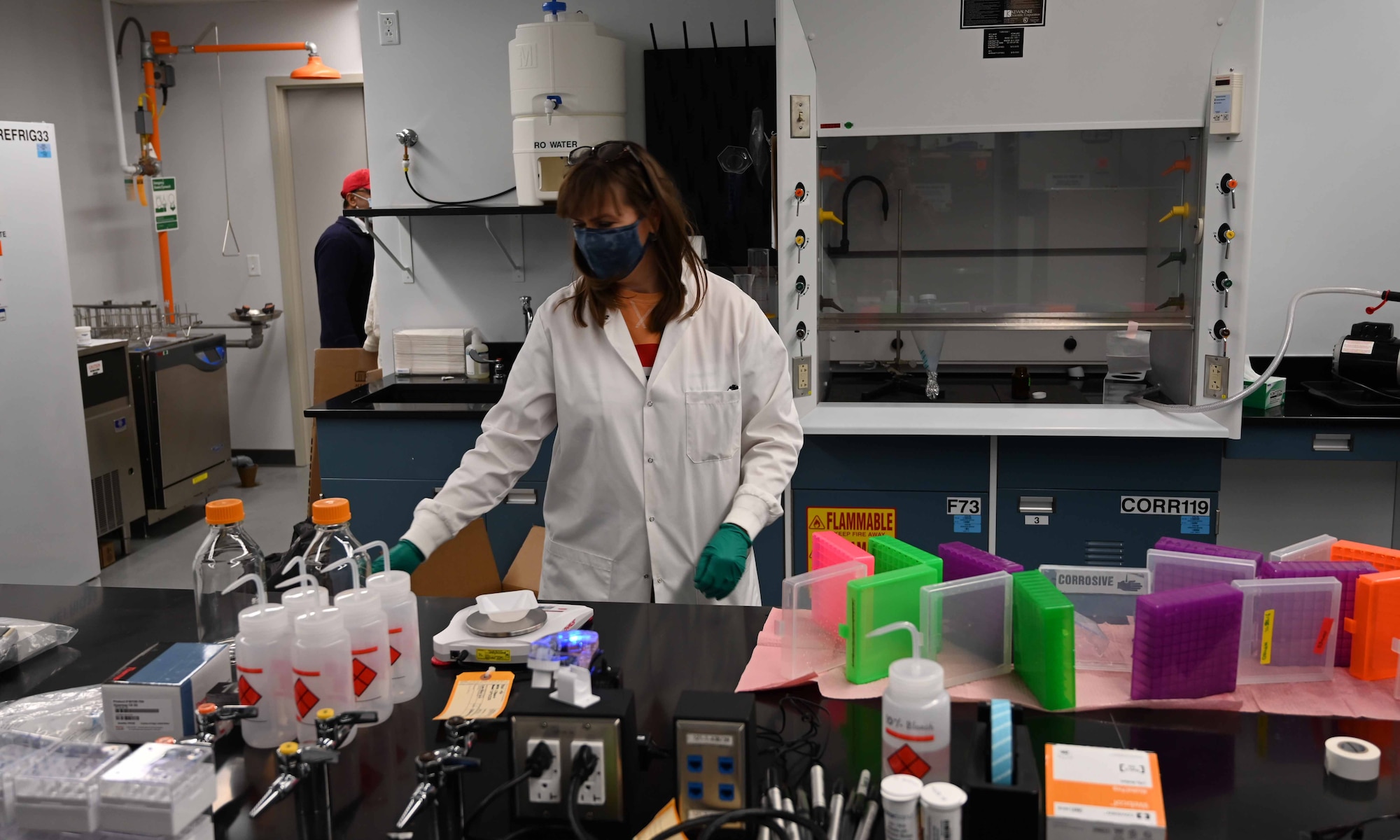 Loryn Bowen, a research biologist, conducts research in AFRL’s newly renovated laboratory for biotechnology and organic synthesis research. (U.S. Air Force photo/Tim Bergeron)