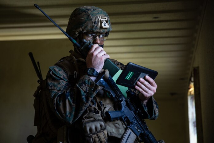 U.S. Marine Corps Sgt. Jonathan Fico, a fire support Marine with 5th Air Naval Gunfire Liaison Company, III Marine Expeditionary Force Information Group, assists in establishing an observation post during an exercise near Camp Hansen, Okinawa, Japan, April 21, 2021. The training allowed 15th Brigade forces to study tactical communication, maneuver and fires increasing interoperability between the two countries.