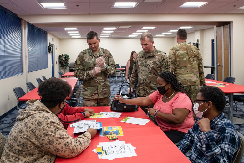 A photo of Airmen taking orders for a family.