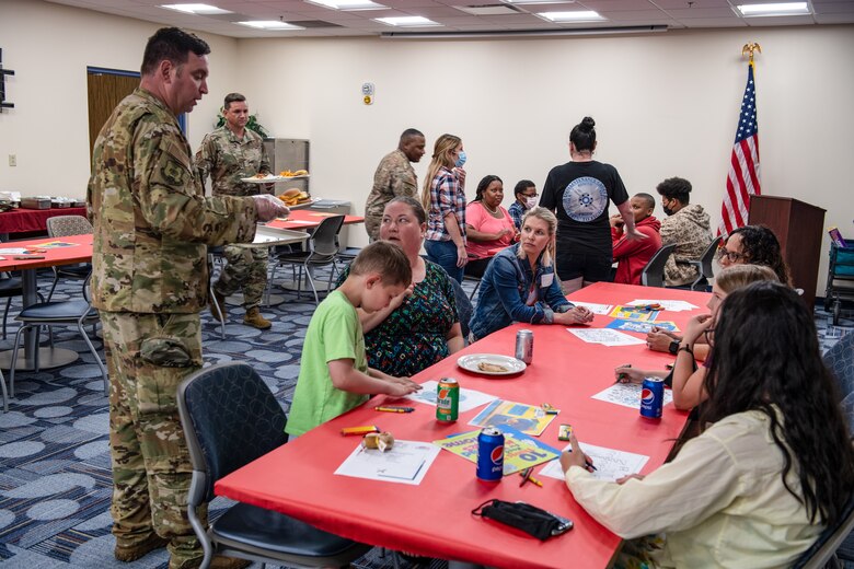 Photo of an Airman serving dinner