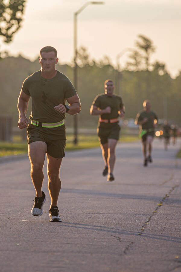 U.S. Marines with 2d Marine Division (MARDIV) run during a physical fitness test as part of the Division Leadership Assessment Program (DLAP) on Camp Lejeune, N.C., June 15, 2021.