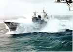 The USS Lake Champlain seen in heavy seas off Cape Horn from the USS Independence (CVA 62), fall of 1988. The Champlain's Hurricane Bow was ripped off in this storm.