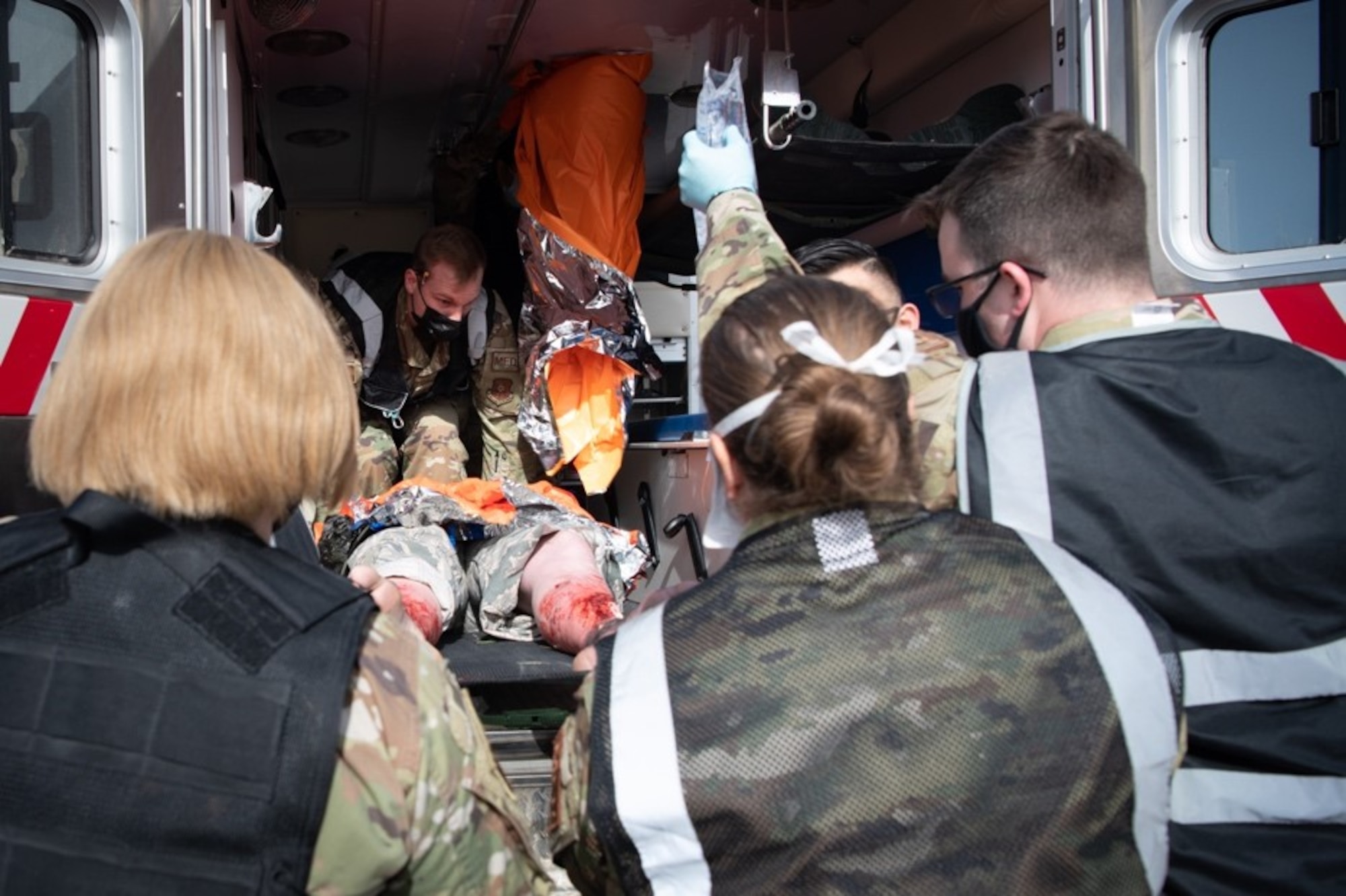 Members of the 28th Medical Group load a simulated injured patient into an ambulance during exercise Ready Eagle on Ellsworth Air Force Base, S.D., May 14, 2021.