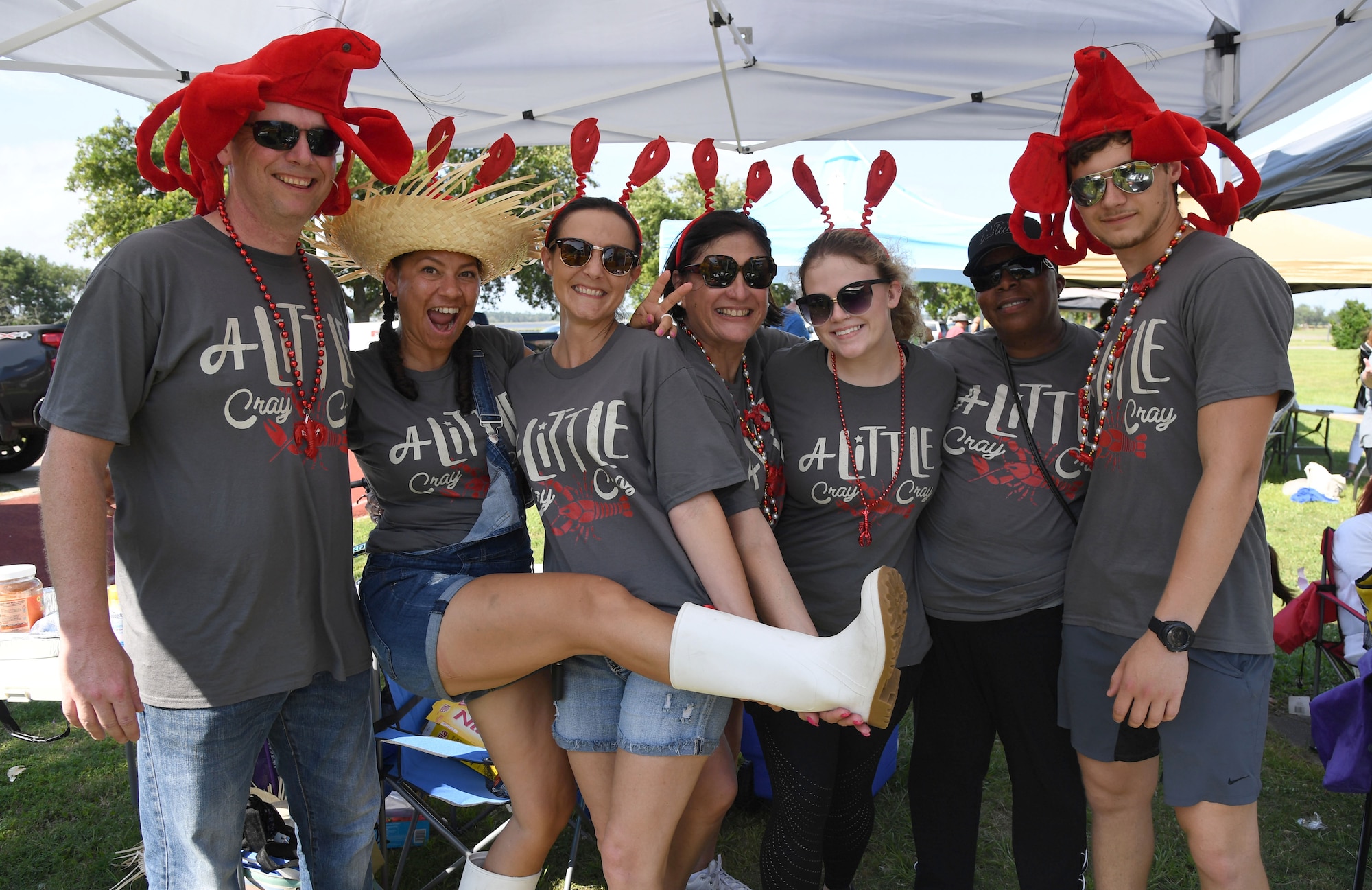 Members of the 81st Training Wing wing staff agency team, "A Little Cray Cray," pose for a photo during the 9th Annual Crawfish Cook-Off at the Bay Breeze Event Center at Keesler Air Force Base, Mississippi, June 11, 2021. Twelve teams competed in the event and more than 800 pounds of crawfish were distributed. (U.S. Air Force photo by Kemberly Groue)