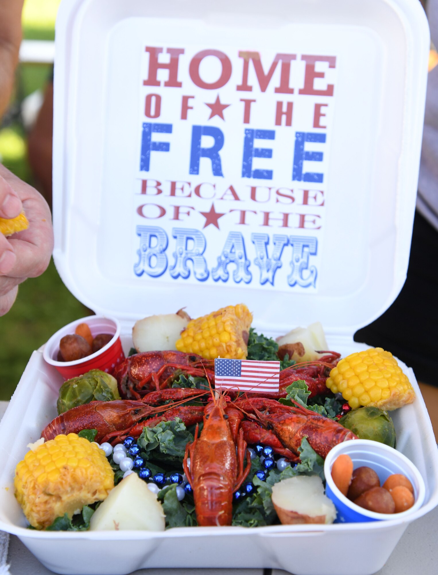 A presentation platter created for the judges by the Second Air Force team, "Krewe of Kraw," is on display during the 9th Annual Crawfish Cook-Off at the Bay Breeze Event Center at Keesler Air Force Base, Mississippi, June 11, 2021. Twelve teams competed in the event and more than 800 pounds of crawfish were distributed. (U.S. Air Force photo by Kemberly Groue)