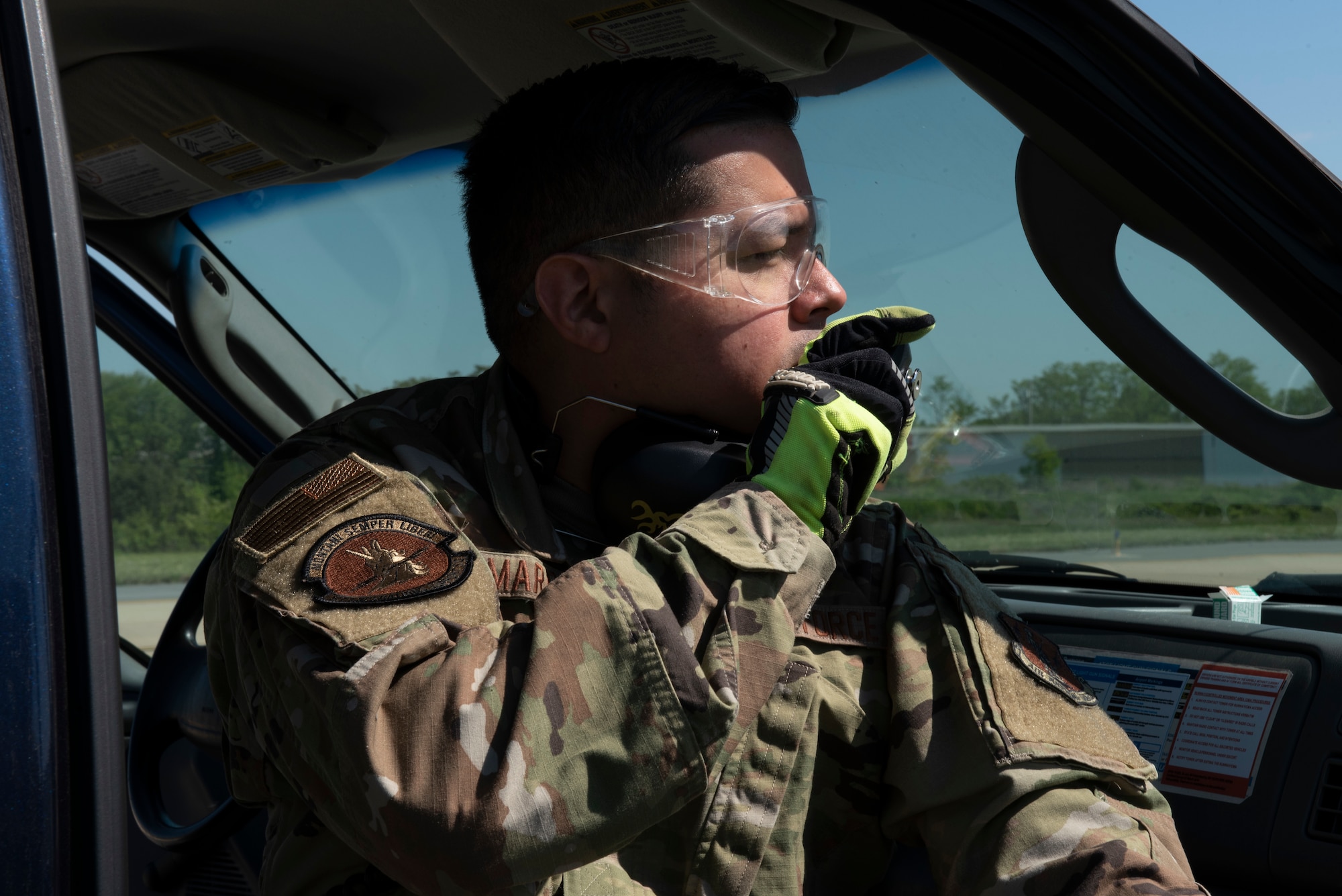 U.S. Air Force Master Sgt. Jose Marrero, noncommissioned officer in charge of airfield management with the 167th Operations Support Group, notifies air traffic control before firing pyrotechnics as part of the Bird/wildlife Aircraft Strike Hazards (BASH) program, at the 167th Airlift Wing, Martinsburg, West Virginia, May 12, 2021. The airfield management team uses many different types of noise making devices to encourage animals to move away from the airfield to ensure safe flying operations.