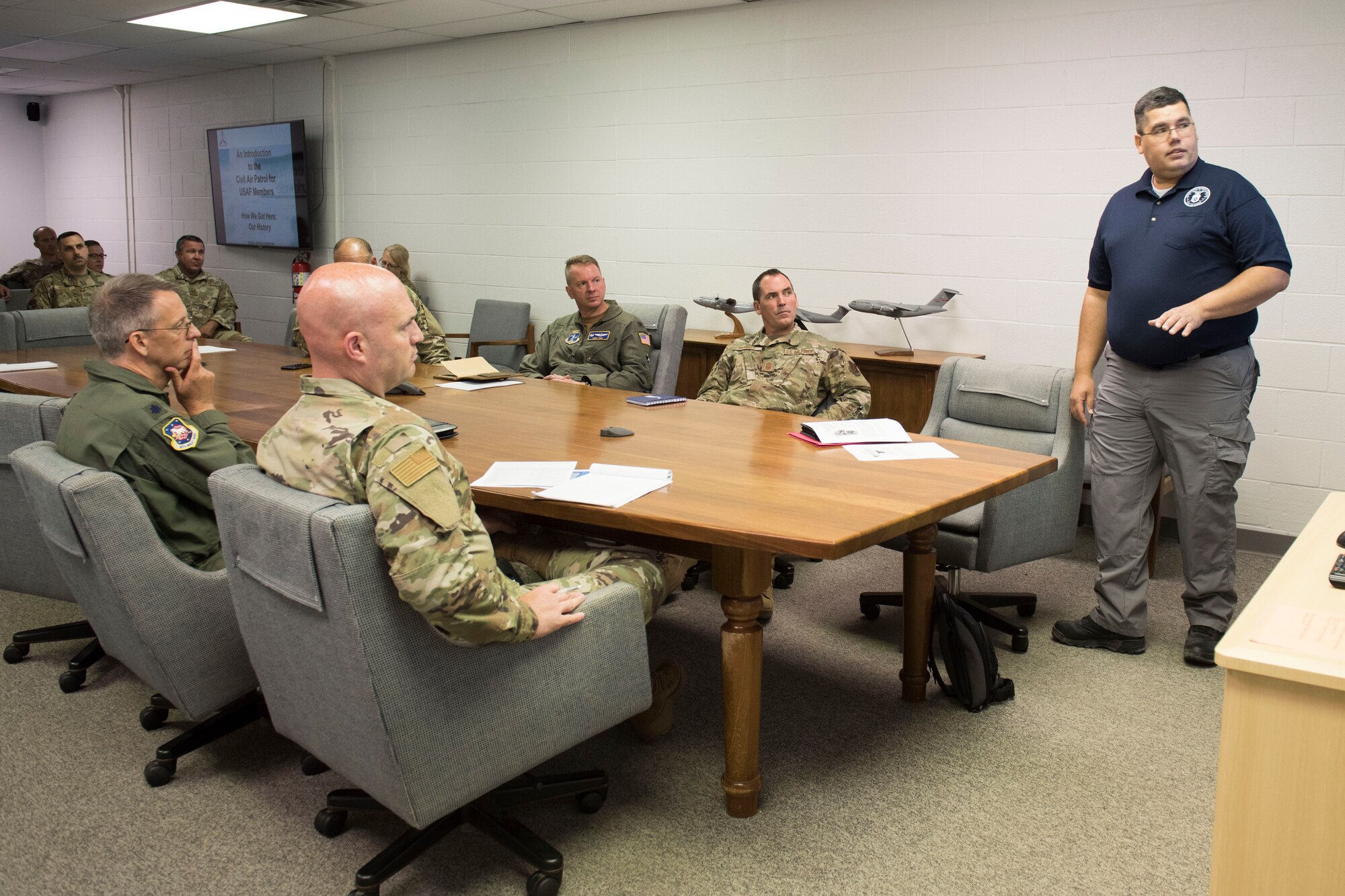 U.S. Civil Air Patrol Capt. Armando Tirado, public affairs officer for the Martinsburg Composite Squadron, delivers a presentation about CAP to 167th Airlift Wing leadership, at Shepherd Field, Martinsburg, W.Va., June 11, 2021. Tirado explained CAP history and capabilities and followed with discussions on ways the wing a