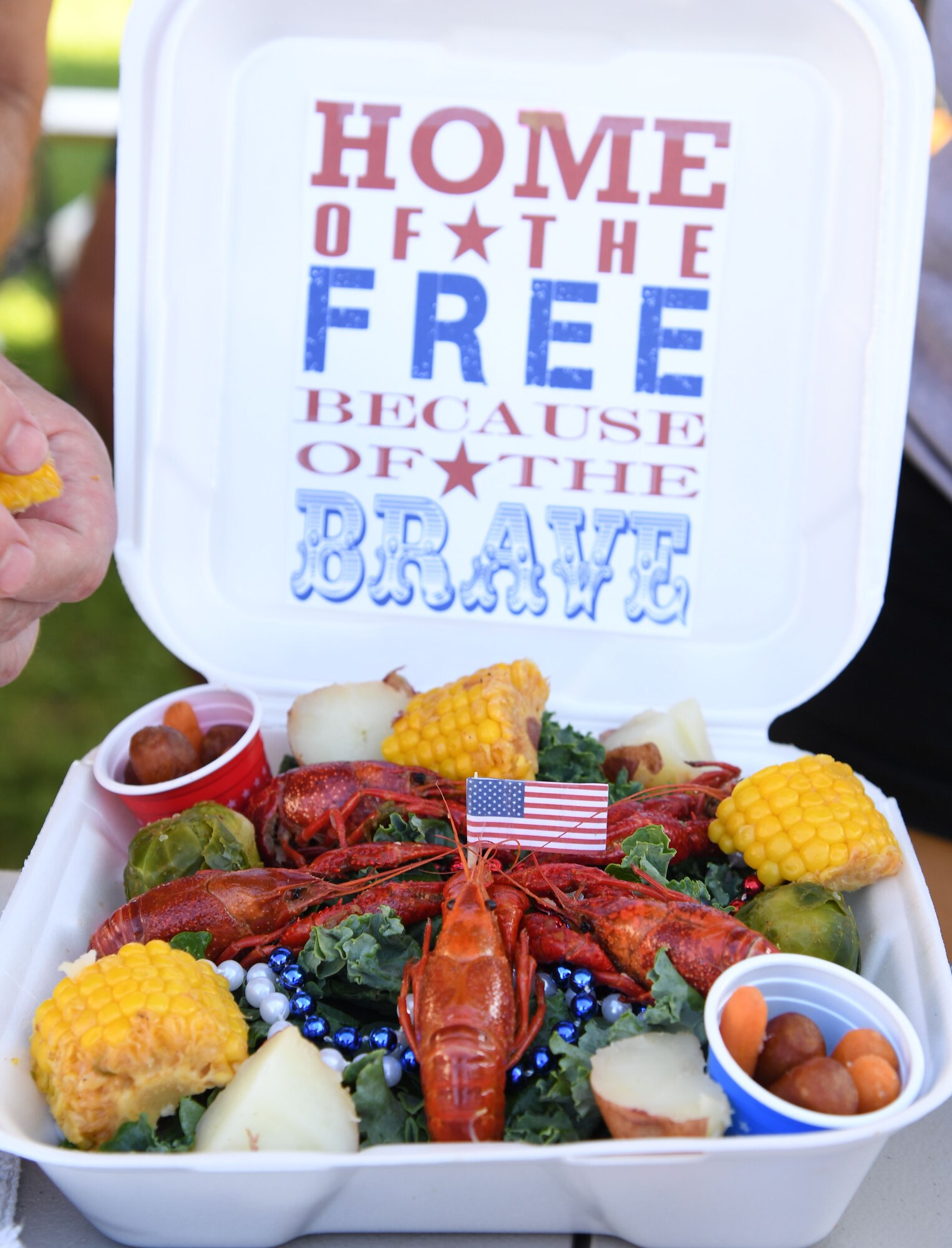 A presentation platter created for the judges by the Second Air Force team, "Krewe of Kraw," is on display during the 9th Annual Crawfish Cook-Off at the Bay Breeze Event Center at Keesler Air Force Base, Mississippi, June 11, 2021. Twelve teams competed in the event and more than 800 pounds of crawfish were distributed. (U.S. Air Force photo by Kemberly Groue)