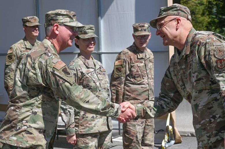 Gen. Arnold W. Bunch, Jr., Air Force Materiel Command commander, shakes hands with Col. Mark Oordt, 66th Medical Squadron commander, during a visit to Hanscom Air Force Base, Mass., June 16, while Chief Master Sgt. Holly Burke, MDS superintendent, and Master Sgt. John Tremblay, 66 MDS first sergeant, look on. Bunch met with MDS personnel to thank them for their support to the Hanscom community during the COVID crisis. (U.S. Air Force photo by Todd Maki)