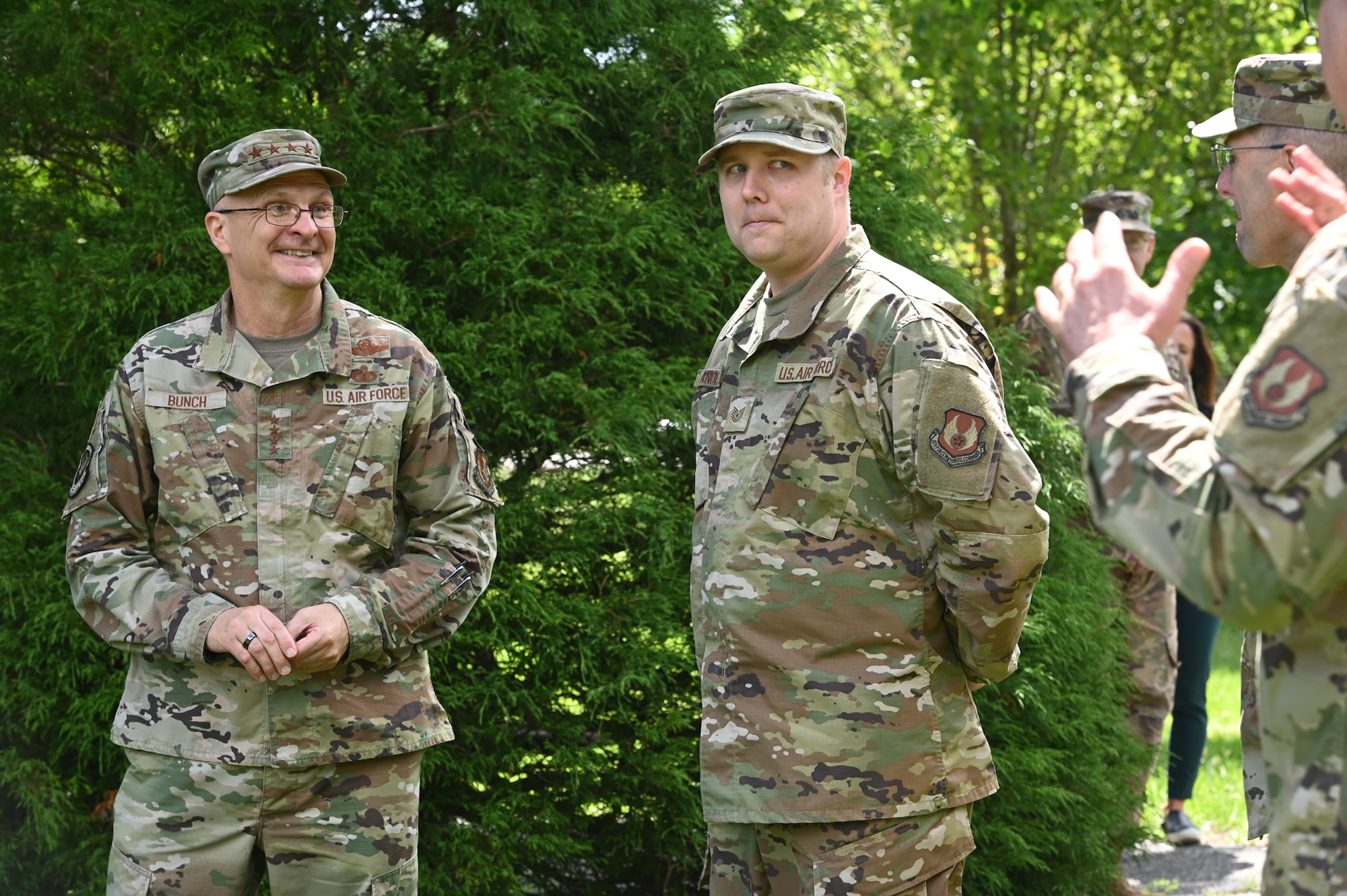 Gen. Arnold W. Bunch, Jr., Air Force Materiel Command commander, thanks Tech. Sgt. Joshua Anderson, 66th Medical Squadron noncommissioned officer in charge of Public Health, for his COVID efforts during a visit to the clinic at Hanscom Air Force Base, Mass., June 16. Bunch presented his coin to Anderson and Capt. Jenifer Mouser, 66 MDS officer in charge of Laboratory and Radiology, during the MDS visit. (U.S. Air Force photo by Todd Maki)